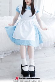 X in a Alice  maid costume